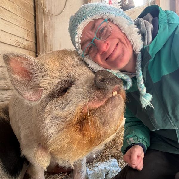 Cara with a pig named Noah