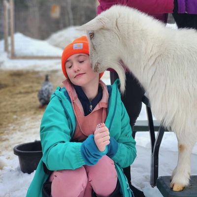 Girl with our goat named Kinsale.
